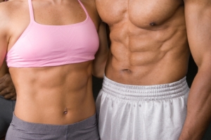Woman and man with visible abs